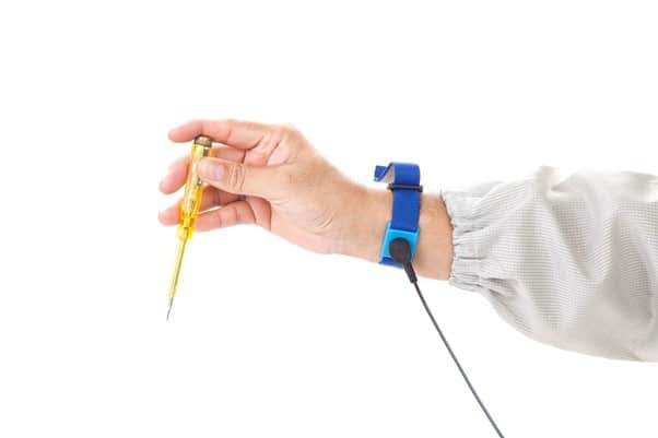 A hand holding a tool with Wrist Strap