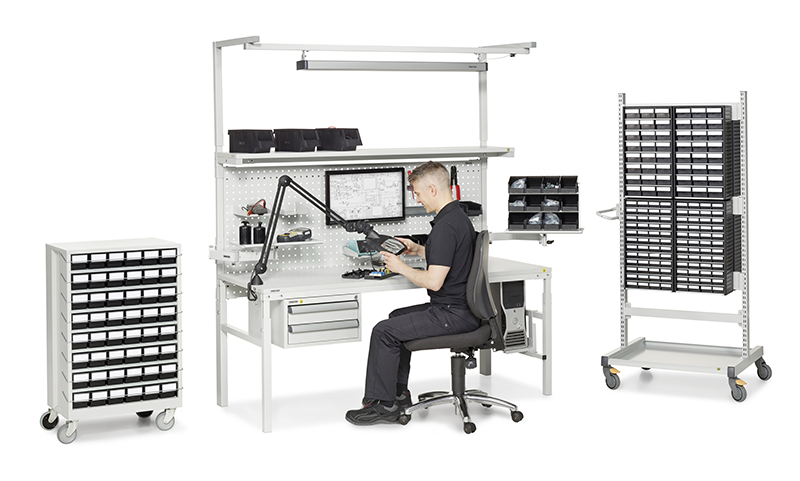 Operative working at ESD KSHB workbench with bench accessories. Bondline.