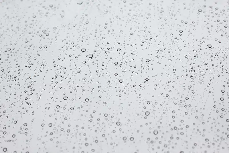 Raindrops on window showing an example of moisture - Bondline