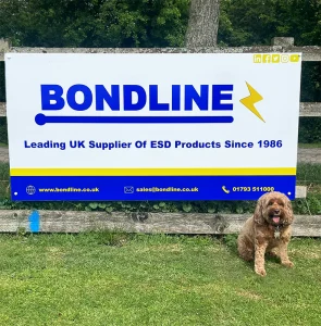 Mollie with Bondline cricket pitch sign.
