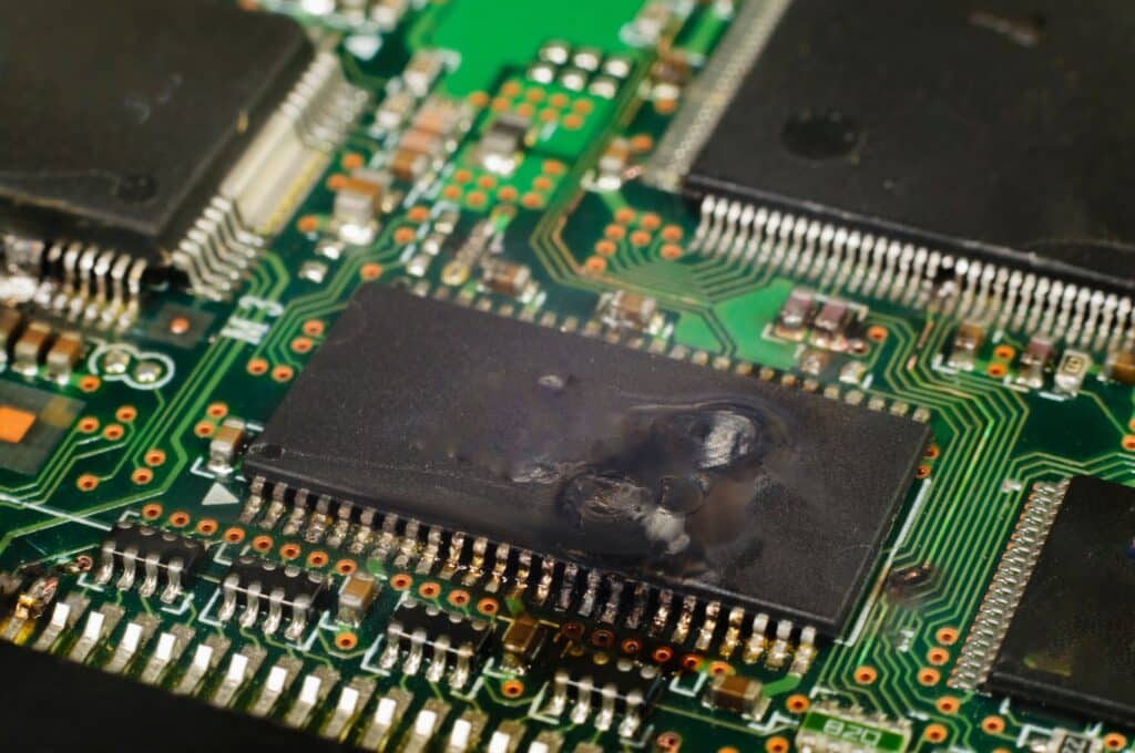 An image showing damage to an electronic integrated circuit. Short circuit. Malfunction in electrical circuit. Bondline Electronics Ltd.